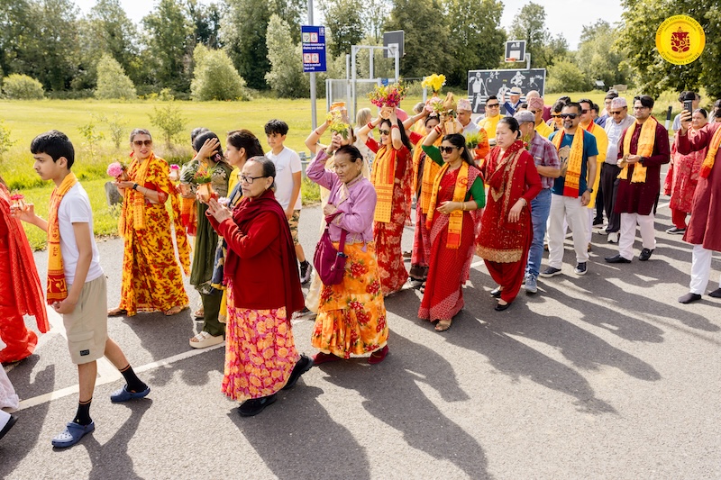 Devotees carrying kalash pots during the Grand Opening procession