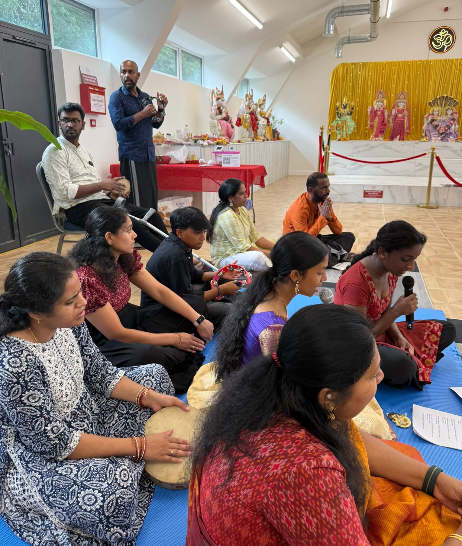 Devotees singing Ayyappa bhajans at Oxford Hindu Mandir