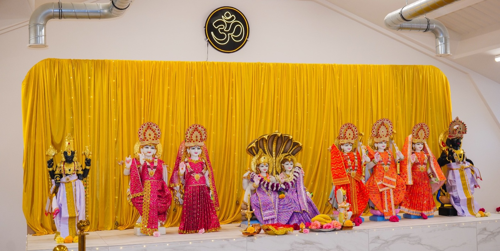 The main altar at Oxford Hindu Mandir, adorned for worship in August 2026