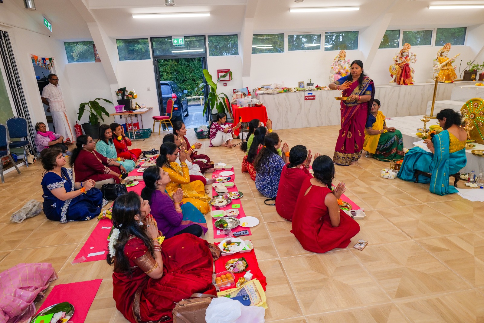 Devotees gathered for samuhika Lakshmi Ashtottara during Vara Mahalakshmi vrat