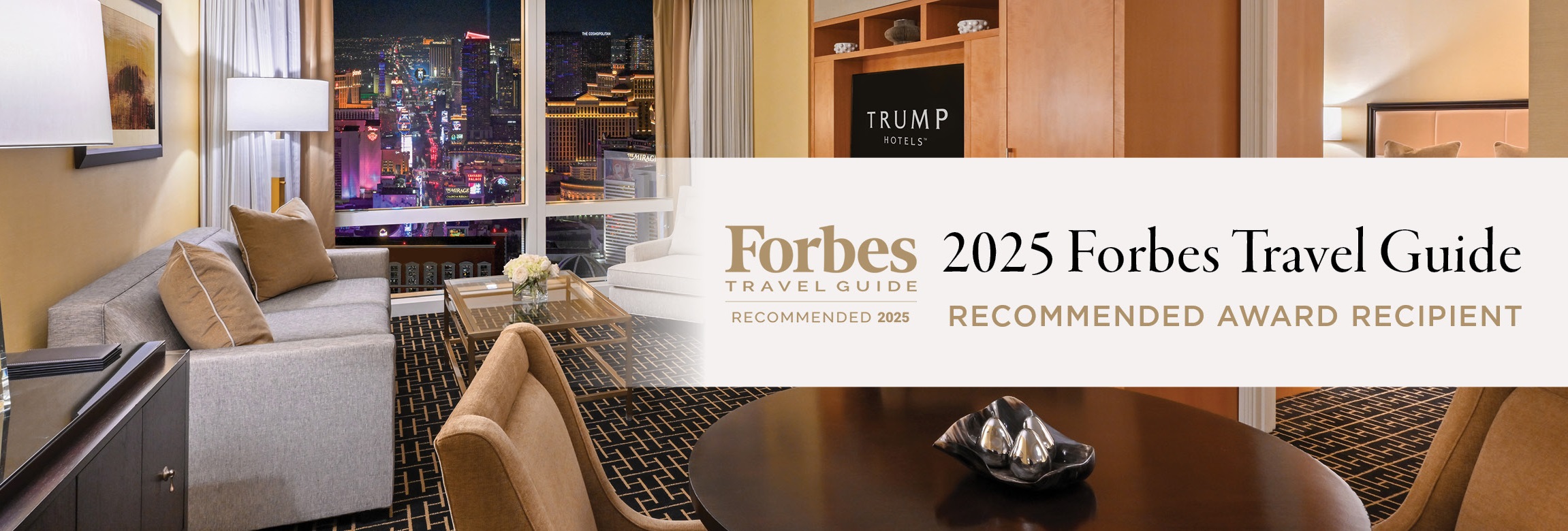 An image of a suite with 'Forbes Travel Guide' and 'Five-Star Award' visible at the foreground