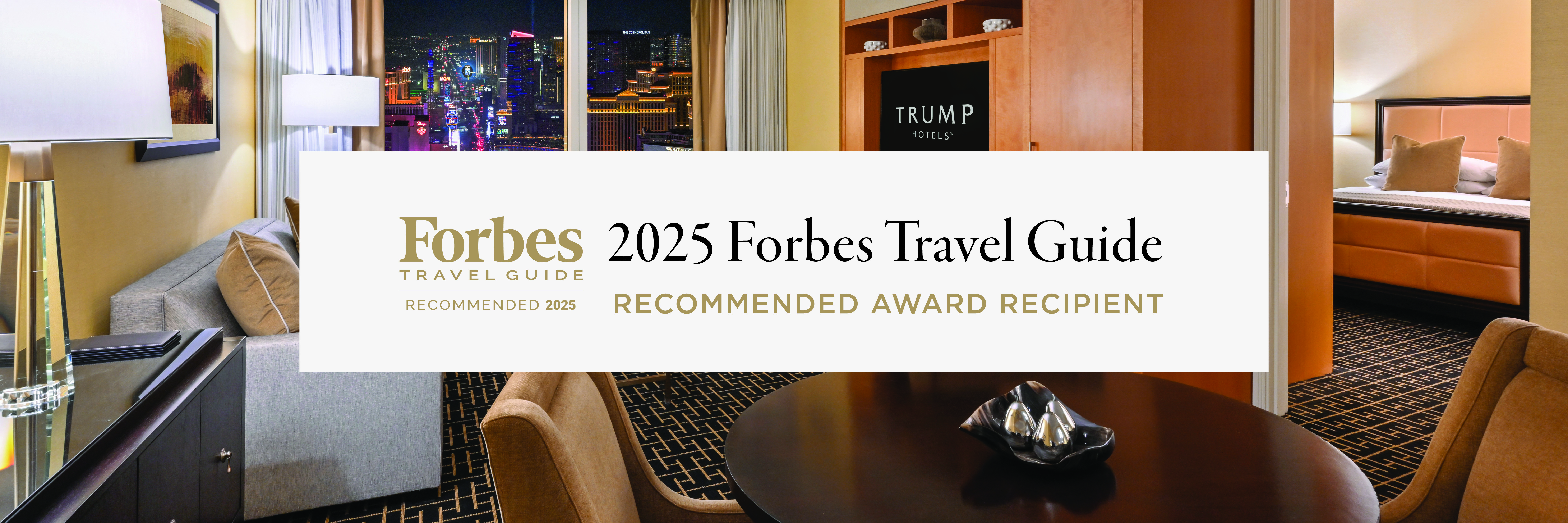 An image of a suite with 'Forbes Travel Guide' and 'Five-Star Award' visible at the foreground