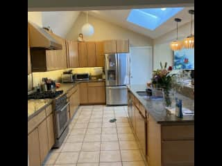 Modern and bright kitchen with skylights and every appliance imaginable.