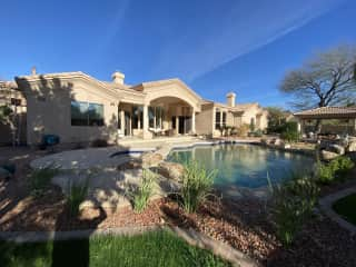 Looking at patio, sun in the morning, with a fan. Sliding door into Family room and kitchen.