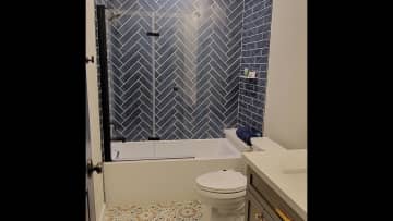 Guest bathroom featuring full soaker tub.