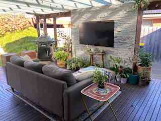 Outdoor space with tv and bbq
