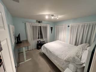 Bedroom, has view of the hills, vineyards, and orchards.