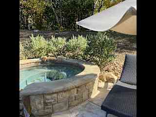 Hot tub, pool, and fire pit in backyard