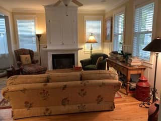 Living room with fireplace and TV