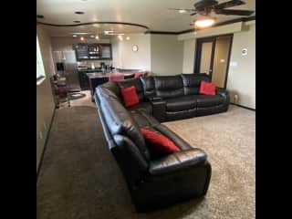 Basement living room kitchen combo. Everything reclines for comfort movie watching.