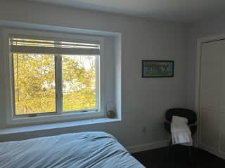 Guest bedroom with windowseat looking out to the water.