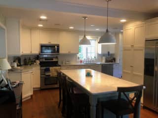 Updated kitchen with marble counter tops.