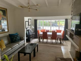 Living/dining room view with a lovely, sunny window seat!