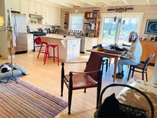 The kitchen and dining room table, being used as an office!