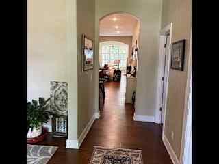 View from just inside front door.  Sitting room to the left and office to the right.
