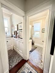 In many old homes, the “toilet room” and the tub and sink room were separated. I’ve kept it this way as I like the old charm and the separation comes in handy at times!