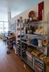 Kitchen storage, including way too many cookbooks that you are welcome to peruse.