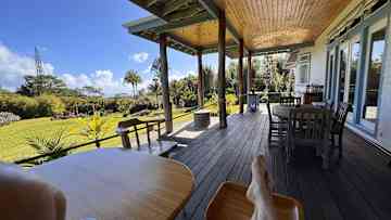 The front outdoor lanai (porch) is a great place to relax, work or dine.
