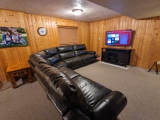 Leather sectional couch with Roku tv.  Includes Netflix, Hulu, Disney+, Amazon Prime