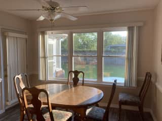Dining room with entrance to sun room. Shows door to fenced in backyard.