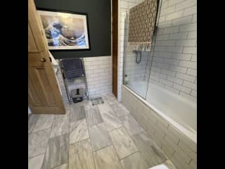 Family bathroom with bath and shower