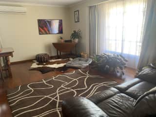 Living/lounge room with Smart TV and reverse cycle airconditioning.