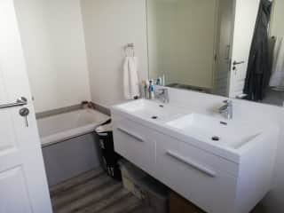 Main bathroom with bath and shower.