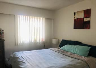 Bedroom - queen bed with memory foam mattress topper, duvet, pillow, and sheets.