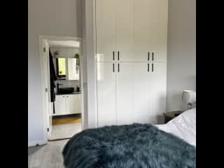 Large wardrobe storage and door to en-suite shower room