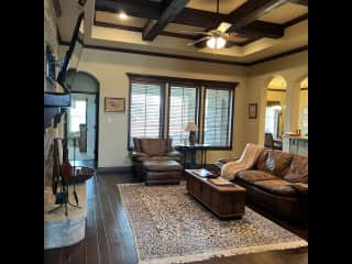 Living room with fireplace and big screen tv.