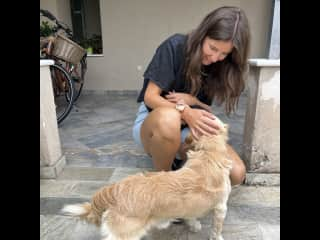 Cuddling with Rudi, our Airbnb dog