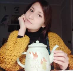 With one of my handpainted teapots :)