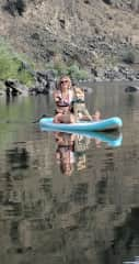 Winnie and I paddle boarding on the river