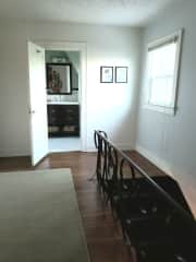 Upstairs hallway and full bathroom with tub and shower