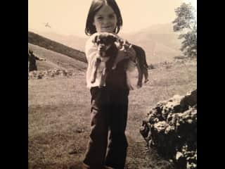 At home we always had pets. This is me with a cute puppy.