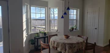 Dinette of kitchen facing mountain view.