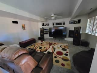 Basement theater room with gas fireplace and heated massager recliners