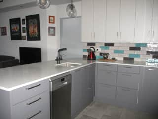 Kitchen showing dish washer and sink