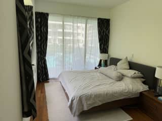 Master bedroom with TV and second balcony