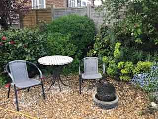 Seating area with water feature and table