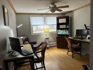 Home office with 2 separate work desk stations,recliner