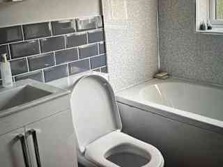 Bathroom with shower over bath.