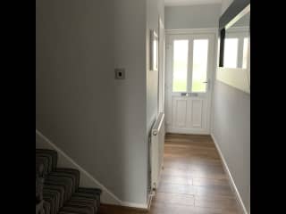 Hall leading to kitchen, utility room and lounge and stairs