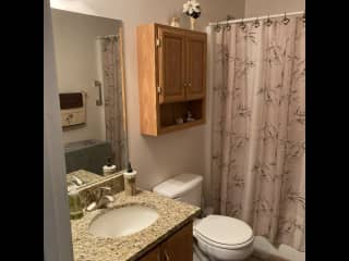 Second bathroom with tub and shower. Bathroom is between the second and third bedrooms