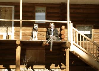 Louise and Dakota at the cabin enjoying the sunshine after a long walk in the forest