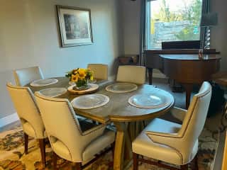 Our dining room does double duty as a music room. A lovely baby grand piano is nestled in a far corner of the Great Room and Dining area.