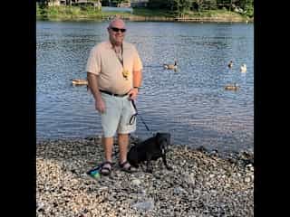 Doug with our pit bull, Cleo.