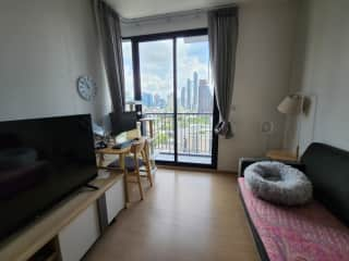 living room with smart TV, work desk, and double seated sofa