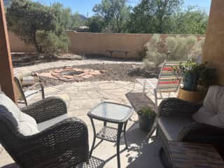 Spacious backyard with fire pit and gorgeous views of the mountains and sky.