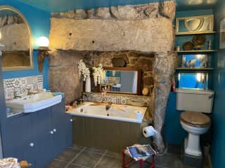 Main bathroom. Bath in fireplace is very small ….. full size bath in guest en-suite.